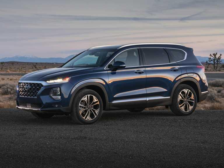 Hyundai Santa Fe 2021 azul desde el lado del conductor delantero